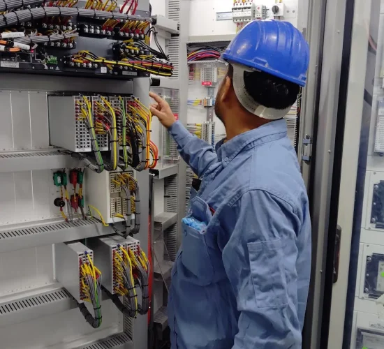 Electrical Installation5_converted DrBuild team connecting circuit breakers in a control panel during electrical setup